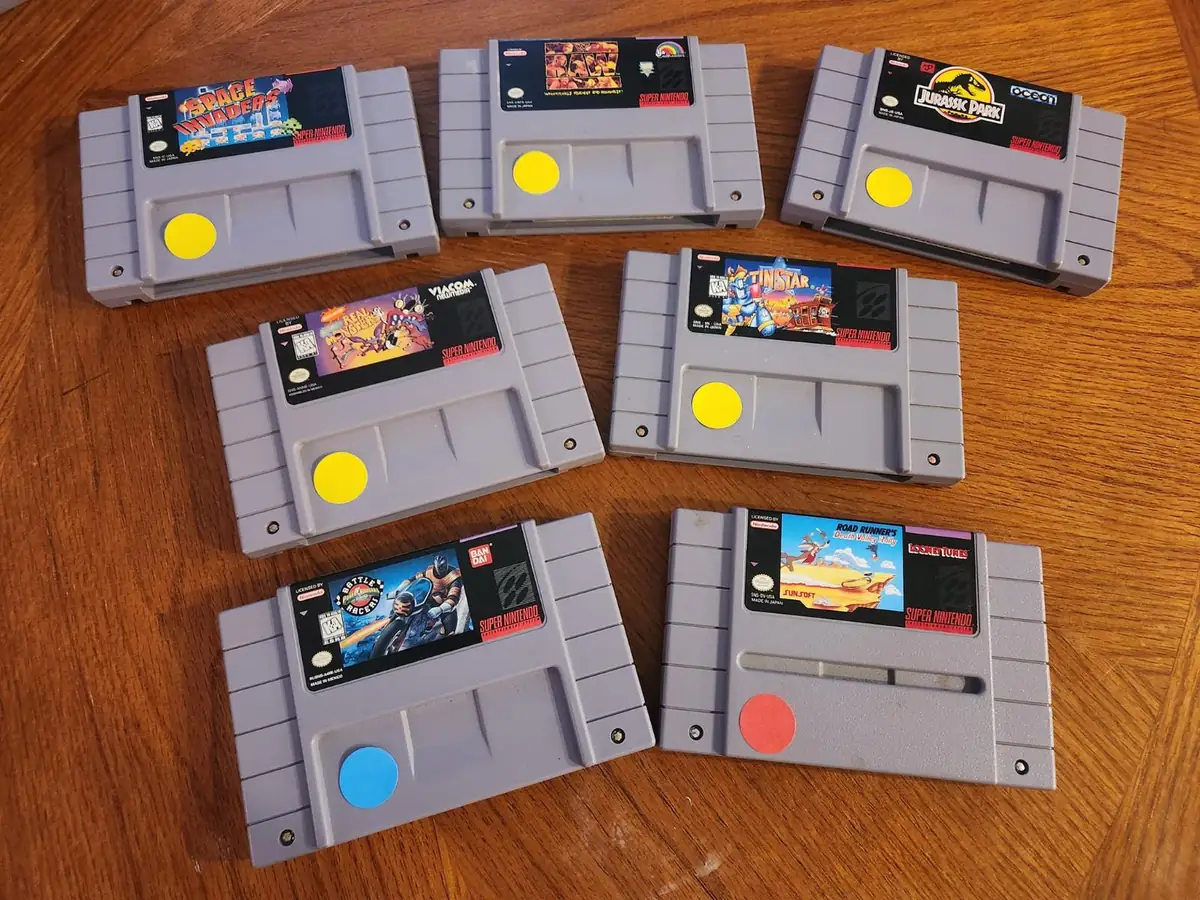 Original Super Nintendo cartridges arranged on a wooden table